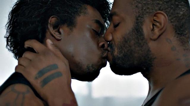 Muscular Jock pounding tattooed black stud on bed