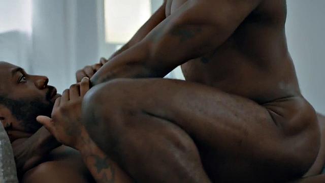 Muscular Jock pounding tattooed black stud on bed