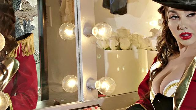 Watch Mistress of Desire's steamy solo play with her curly hair, boots, and fishnet stockings