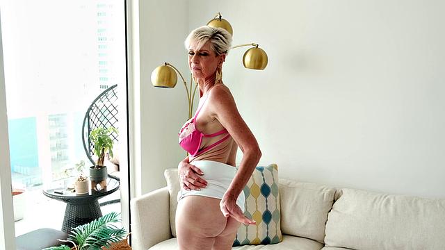 Meet Foxxxy, a 60-year-old MILF and GILF with big tits and a pierced clit