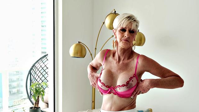 Meet Foxxxy, a 60-year-old MILF and GILF with big tits and a pierced clit