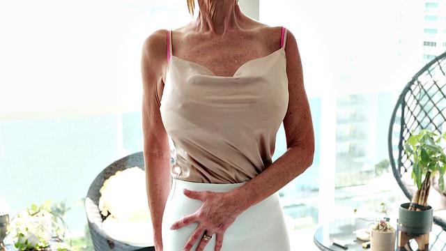 Meet Foxxxy, a 60-year-old MILF and GILF with big tits and a pierced clit