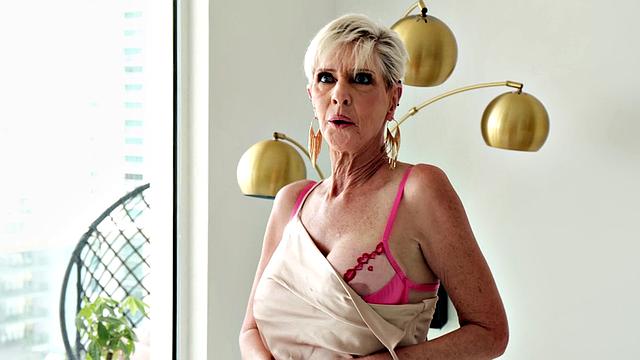 Meet Foxxxy, a 60-year-old MILF and GILF with big tits and a pierced clit