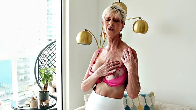 Meet Foxxxy, a 60-year-old MILF and GILF with big tits and a pierced clit