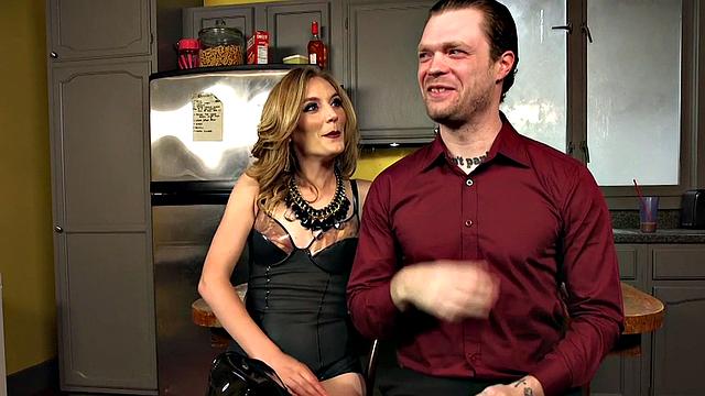 Leather domme humiliates subject in kitchen session
