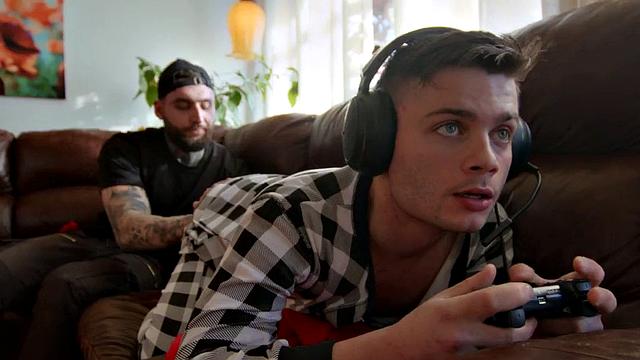 Muscled jock with tattoos barebacks gamer's asshole