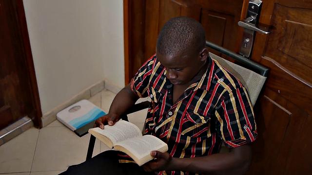 African twink jerks black cock in solo action till cum