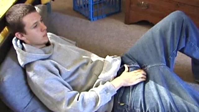 After using the remote to cue up a porn video, young Derek massages his crotch and wakes up his monster. Once the clothes are off, he starts to stroke and it doesn't take long for Derek to cum all over his hairy tummy.