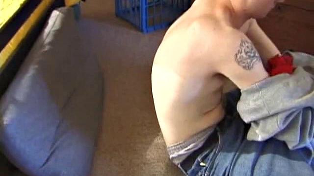 After using the remote to cue up a porn video, young Derek massages his crotch and wakes up his monster. Once the clothes are off, he starts to stroke and it doesn't take long for Derek to cum all over his hairy tummy.