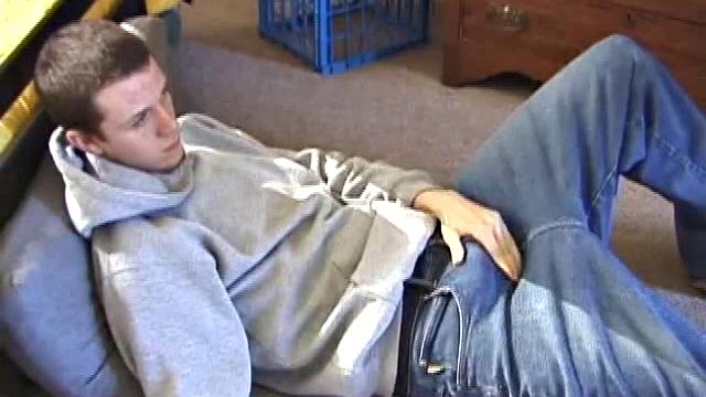 After using the remote to cue up a porn video, young Derek massages his crotch and wakes up his monster. Once the clothes are off, he starts to stroke and it doesn't take long for Derek to cum all over his hairy tummy.