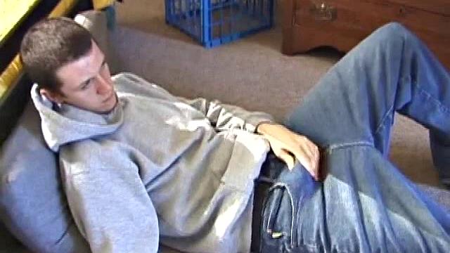 After using the remote to cue up a porn video, young Derek massages his crotch and wakes up his monster. Once the clothes are off, he starts to stroke and it doesn't take long for Derek to cum all over his hairy tummy.