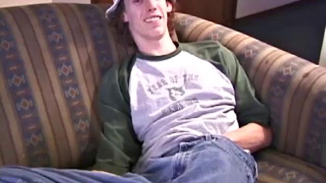 RJ Davis is a 21 year old Texas native, who wants to show the world his unique talents. Naked on the couch, he starts to rub his cock and then makes use of a purple vibrator, which he clearly enjoys.