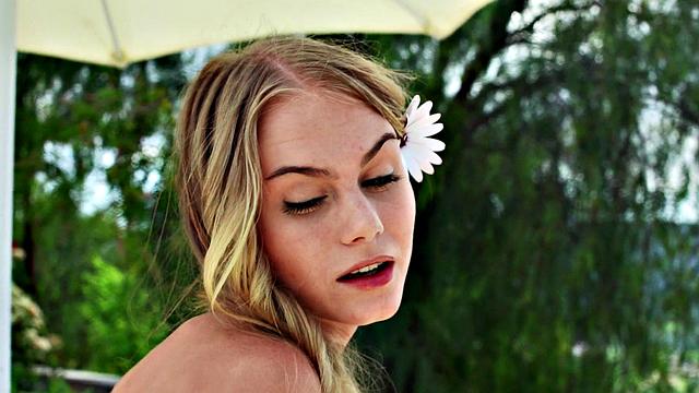 Watch Nancy, the naughty chick, tease her trimmed pussy in public with a thong