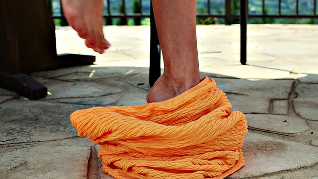 Watch Nancy, the naughty chick, tease her trimmed pussy in public with a thong