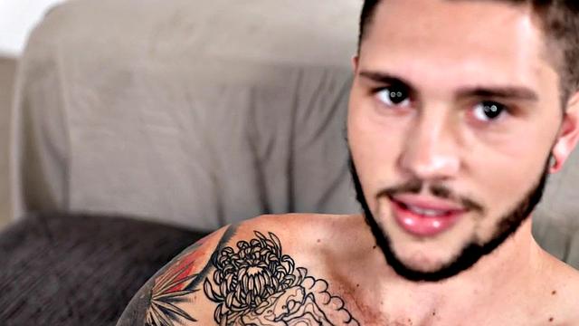 Tattooed stud stroking hairy shaft during solo scene