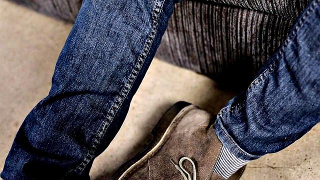 Tattooed stud stroking hairy shaft during solo scene