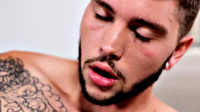 Tattooed stud stroking hairy shaft during solo scene