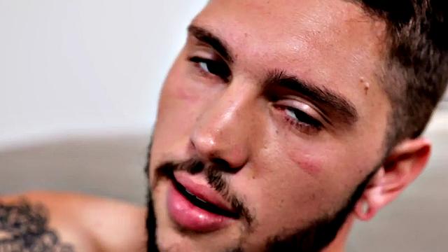 Tattooed stud stroking hairy shaft during solo scene