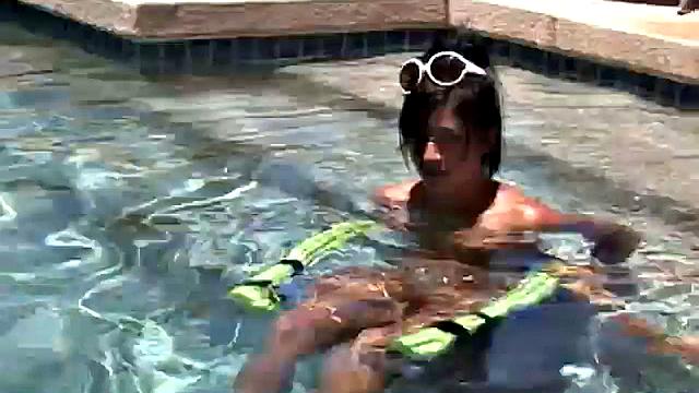 Babe on lilo in the sun