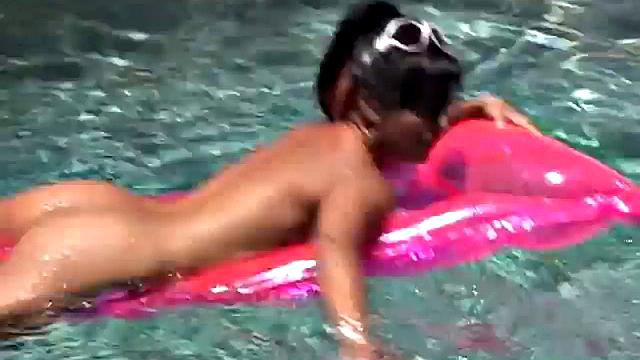 Babe on lilo in the sun