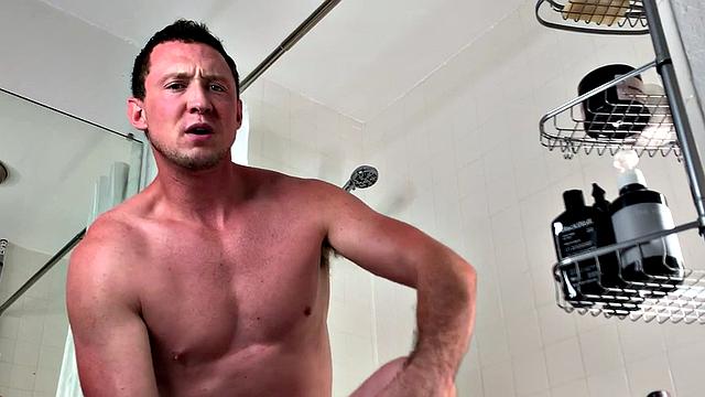 Muscled jock solo jerking while showering