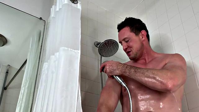 Muscled jock solo jerking while showering