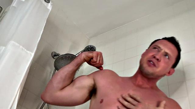Muscled jock solo jerking while showering