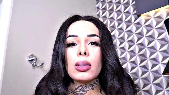 Watch this tattooed brunette tease her body in lingerie & tug on her tiny tits in solo play