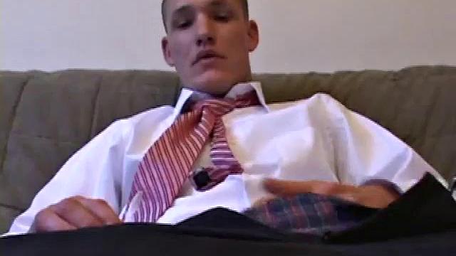 Jay unzips, pulls out a raging boner and strokes to a porn video. After stripping off his shirt, Jay works his cock as he talks to the camera. In no time he explodes a killer cum shot on his face.