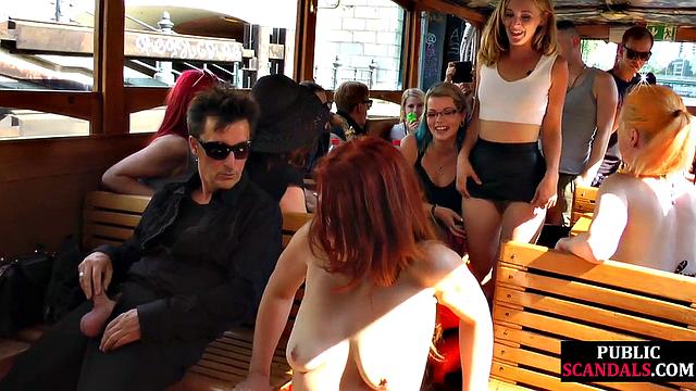 Redhead cougar cockriding on boat