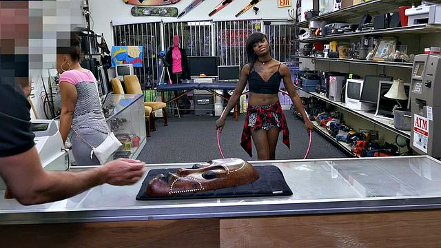 A tattooed ebony babe get her pussy pounded in a pawnshop while wearing a bra and a top