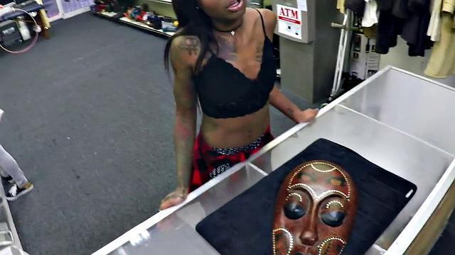 A tattooed ebony babe get her pussy pounded in a pawnshop while wearing a bra and a top