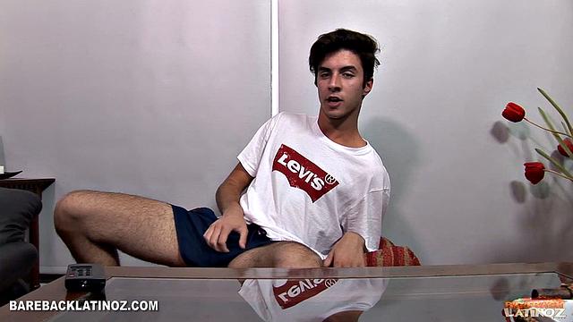 Our featured solo of the week is boy next door Marcuccio. Wearing shorts and a t-shirt, the young Latino is in the living room and wastes no time reaching for his package.