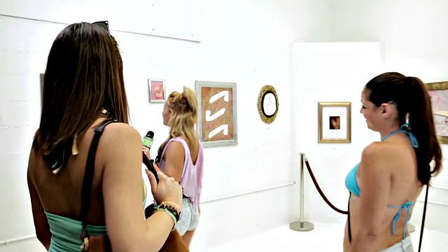 Tattooed babe gives a hot beach blowjob in reverse cowgirl pose