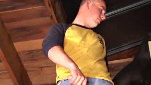 Perched in the rafters of an old garage, Cory Woodall begins stroking his dick. It doesn't take very long for a massive drop of cum t ohit the floor below.
