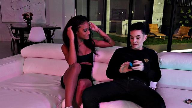 Strapon queer fucks Black pussy on couch at home