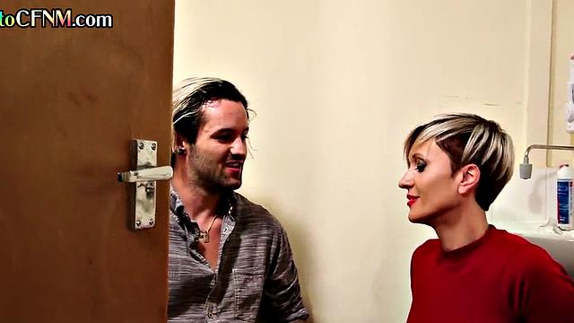 Dirtytalking MILF passionately wanking cock in bathroom