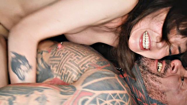 Tattooed fellow plows dark haired babe, making her jizz hard.