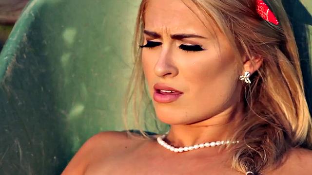 Blonde in lingerie & glasses masturbates in the garden while wearing thongs