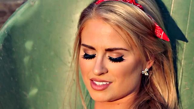 Blonde in lingerie & glasses masturbates in the garden while wearing thongs