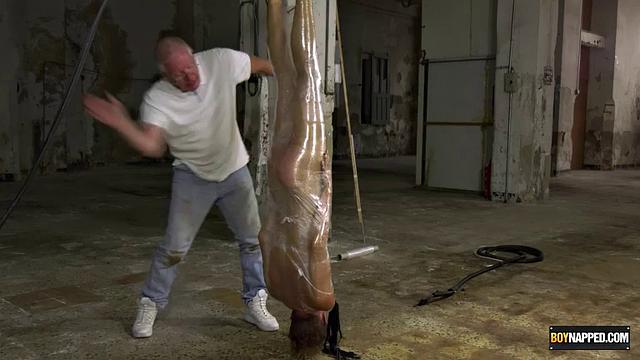Ariel Black hangs bound and exposed while Sebastian Kane takes full control