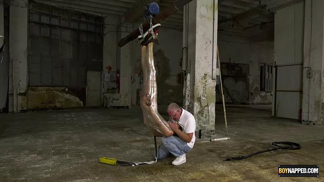 Ariel Black hangs bound and exposed while Sebastian Kane takes full control