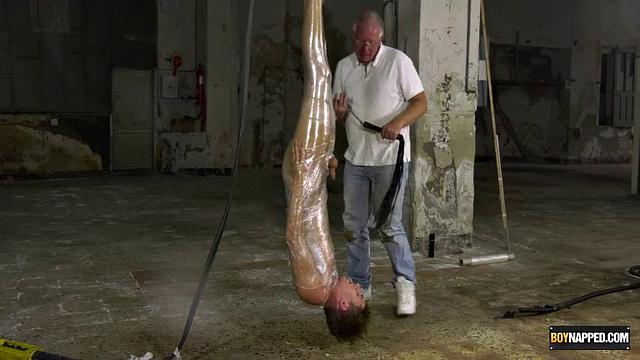 Ariel Black hangs bound and exposed while Sebastian Kane takes full control