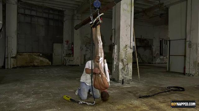 Ariel Black hangs bound and exposed while Sebastian Kane takes full control