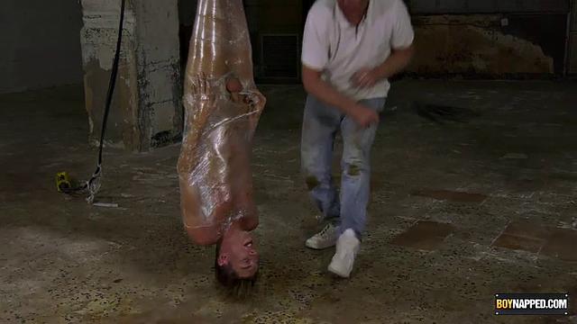 Ariel Black hangs bound and exposed while Sebastian Kane takes full control