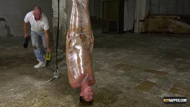 Ariel Black hangs bound and exposed while Sebastian Kane takes full control