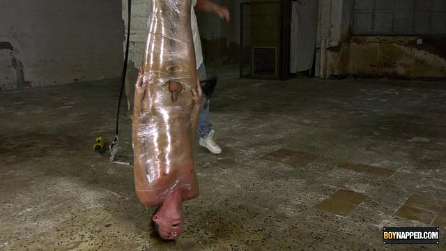 Ariel Black hangs bound and exposed while Sebastian Kane takes full control