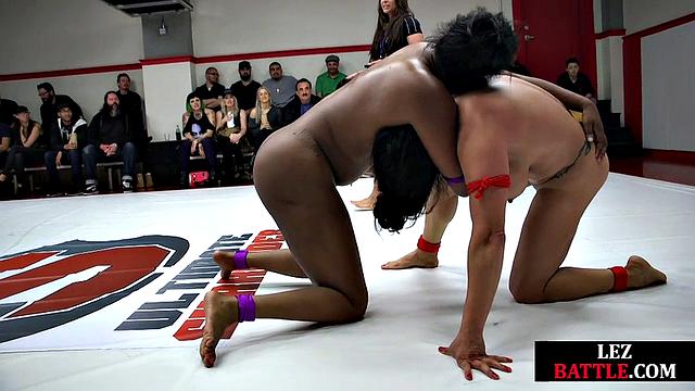 Horny lesbians wrestling in a fight