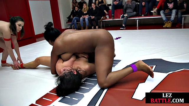 Horny lesbians wrestling in a fight