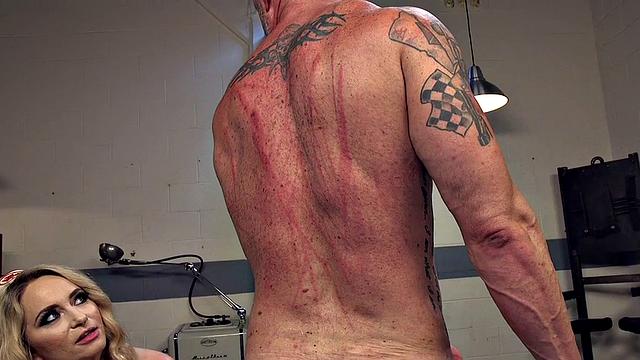 BDSM nurse femina dominates over male in medical room